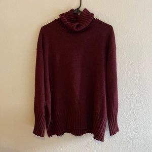 Loose fitting turtle neck drop shoulder sweater
